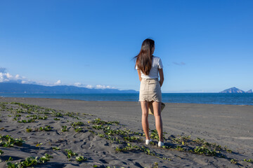 Wall Mural - Travel woman look at the sea beach in Taiwan Yilan