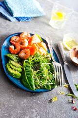 Canvas Print - Buddha bowl with soft boiled egg, avocado, greens, grilled shrimps and sauce. Lunch bowl.