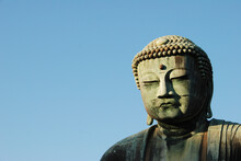 Close-up Of Giant Buddha Statue Against Clear Sky