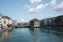 Buildings By Limmat River Against Sky