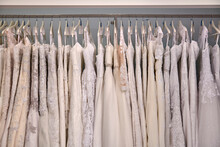 Wedding Dresses Hanging On Clothes Rack At Store