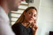 © Cavan Images - Businesswoman looking at male colleague during business meeting at office