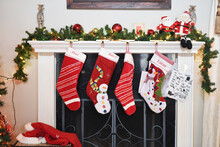 Christmas Stockings Hanging By Fireplace At Home