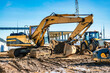 Yellow crawler excavator at the construction site. Earthworks at a construction site. Modern earthmoving equipment.