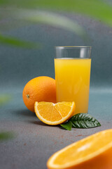 Wall Mural - Glass of fresh juice and ripe orange