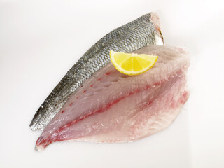 Sticker - Grey Gilthead Seabream Fillet with Lemon isolated on white Background