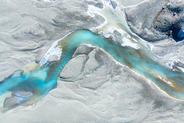 Wall Mural - drone view of the azure river in the glacier valley. view of the moraines. landscape from the air. r