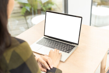 computer screen blank mockup.hand woman work using laptop with white background for advertising,contact business search information on desk at coffee shop.marketing and creative design