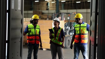 Wall Mural - group of warehouse asian indian workers wearing safety hardhats helmet inspection in container at wa