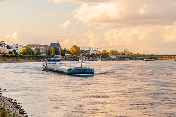 BONN, GERMANY - September 25 2022: A barge a flat-bottomed ship built mainly for river and canal transport of heavy goods.