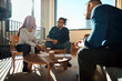© Flamingo Images - Smiling group of diverse businesspeople meeting in an office together