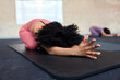 © Flamingo Images - Fit woman practicing yoga in a gym