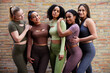 © Flamingo Images - Diverse female friends standing together in a gym