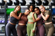 © Flamingo Images - Smiling group of fit women standing together in a gym