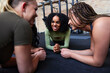 © Flamingo Images - Smiling female friends planking on a gym floor