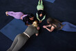 © Flamingo Images - Fit group of women planking on a gym floor