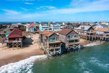 Wall Mural - Aerial View of Beach Homes in Rodanthe North Carolina With Pilings in the Water at High Tide on a Sunny Day