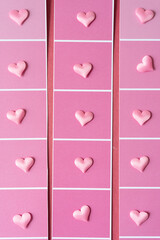 Wall Mural - array of pink pillow heart confetti on paper with squares