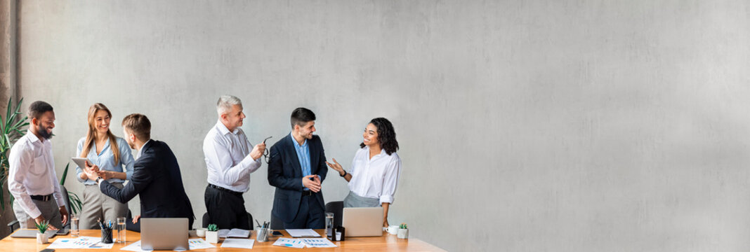 Wall Mural - Coworkers Communicating Standing During Business Meeting In Modern Office, Banner