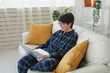 © satura_ - Work online remote from home concept. Woman relaxing in pajama while video call meeting