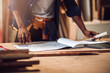 © DJ Creative Studio - Portrait african american man carpenter craftman working in wood factory, small business wood workshop. Timber industry and furniture factory.