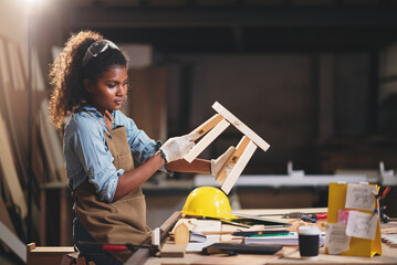 Wall Mural - Portrait of happy carpenter woman working at wood workshop small business, DIY handmade wood furniture industry.