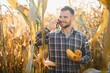 © Serhii - Agronomist checking corn if ready for harvest. Portrait of farmer.