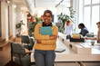 © Flamingo Images - Smiling businesswoman at work in an office