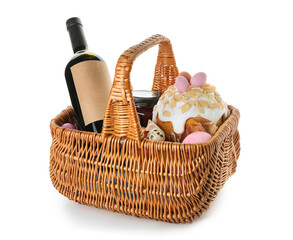 Wall Mural - Basket with Easter eggs, cake and bottle of wine isolated on white background