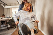 © Flamingo Images - Laughing businesswoman being pushed in a chair