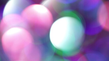 Wall Mural - Abstract defocused lights, Colorful Bokeh. Blur multicolored confetti background with bokeh for carnival. Neon bokeh motion with blue, green, magenta and purple colors. Real Light Leaks 4K footage.