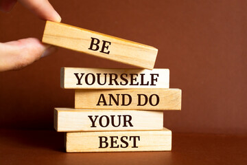 Wall Mural - Wooden blocks with words 'Be yourself and do your best'.