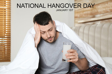 Wall Mural - National hangover day - January 1st. Man taking remedy to relieve effects of alcohol consumption at home