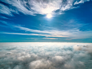 Wall Mural - the background of the morning sunrise from the air with the clouds and the rising sun is very impres