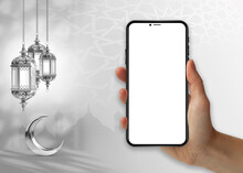 A Hand Holding A Phone With A Crescent Moon And A Crescent Moon Hanging On The Wall Islamic Ramadan .smartphone  Mockup