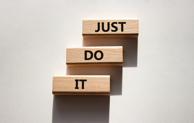 Wall Mural - Just do it symbol. Wooden blocks with words Just do it. Beautiful white background. Business and Just do it concept. Copy space.