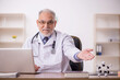 © Elnur - Old male doctor studying molecular model at the hospital
