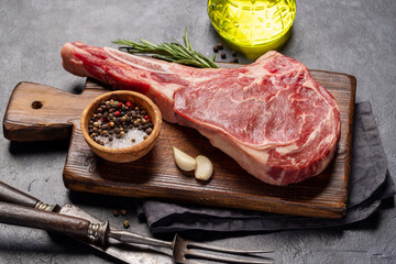 Canvas Print - Raw Tomahawk beef steak and spices