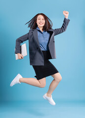 Wall Mural - Asian businesswoman on blue background