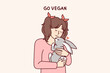 © drawlab19 - Little vegan older girl hugs rabbit that they wanted to use for food and cook for dinner. Concept of transition to healthy nutrition and promotion of vegan lifestyle from childhood and adolescence
