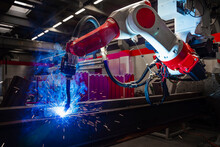 Robotic Arm Doing Welding In Industry