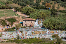 Italy, Tuscany, Saturnia, People Bathing In Cascate Del Mulino Thermal Pool