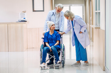 Wall Mural - Professional medical doctor team with stethoscope in uniform discussing with patient woman with cancer cover head with headscarf of chemotherapy cancer in hospital.health care concept