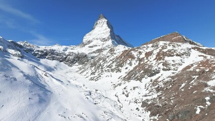 Wall Mural - Beautiful Zermatt ski resort with view of the Matterhorn peak on the horizon. Beautiful Swiss Alps.