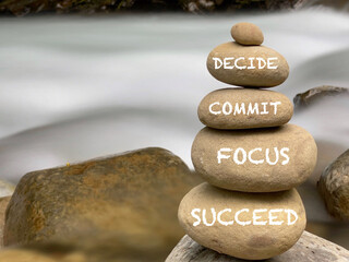 Wall Mural - Inspirational and motivational words of decide commit focus succeed on stones with vintage background.