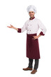 © opolja - Full length of smiling young cook in uniform standing isolated. Looking camera pointing