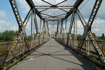 Old metal bridge across Dniester river in the city of Halych, western Ukraine