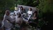 © Marco - Friends and family eating food together at home patio backyard