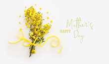 Mother's Day Concept With Spring Yellow Mimosa Flowers Over White Isolated Background