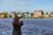 © Noppasinw - Dutch traditional house at Zaanse Schans Village near Amsterdam Netherlands with tourist woman